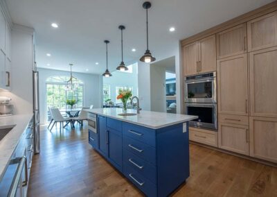 Kitchen with blue island cabinets